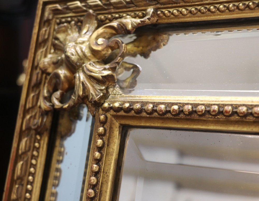This lovely 19th century French mirror is of cushion form. View VIII