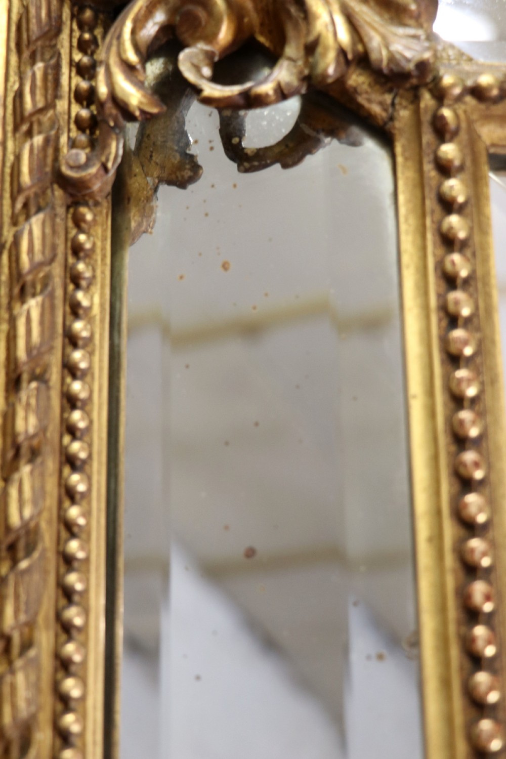 This lovely 19th century French mirror is of cushion form. View X