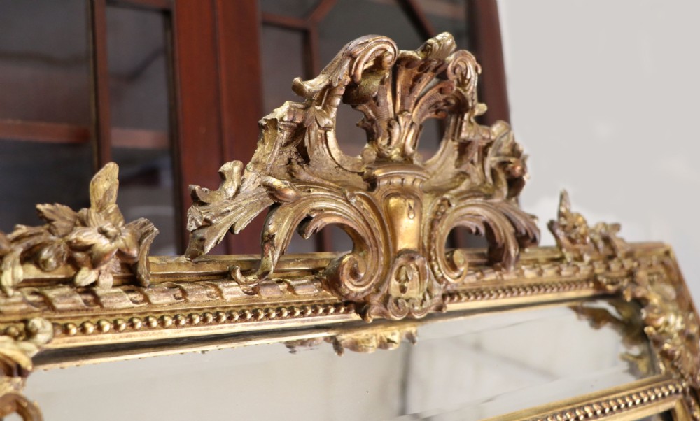 This lovely 19th century French mirror is of cushion form. View XI
