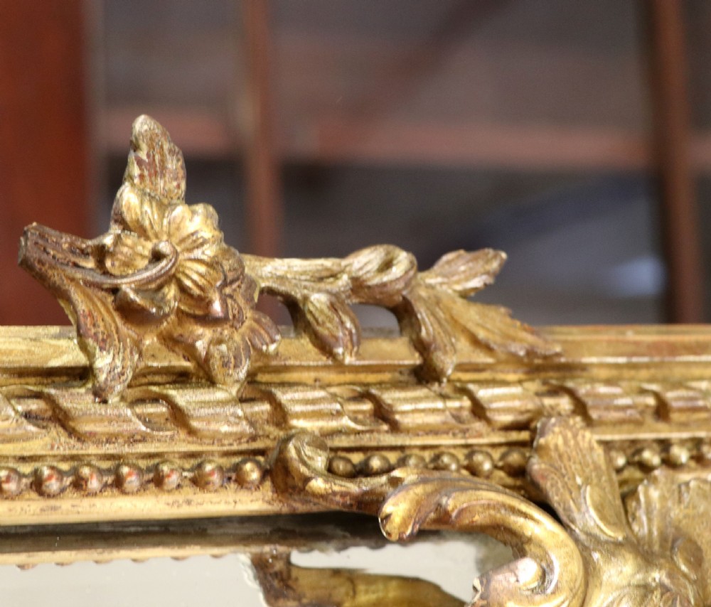 This lovely 19th century French mirror is of cushion form. View XII