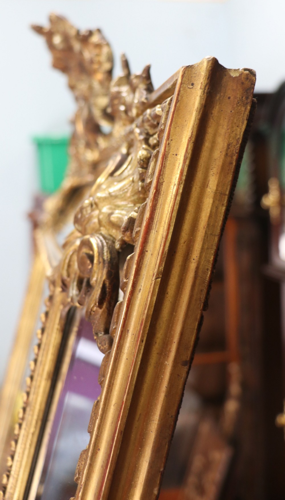 This lovely 19th century French mirror is of cushion form. View XV