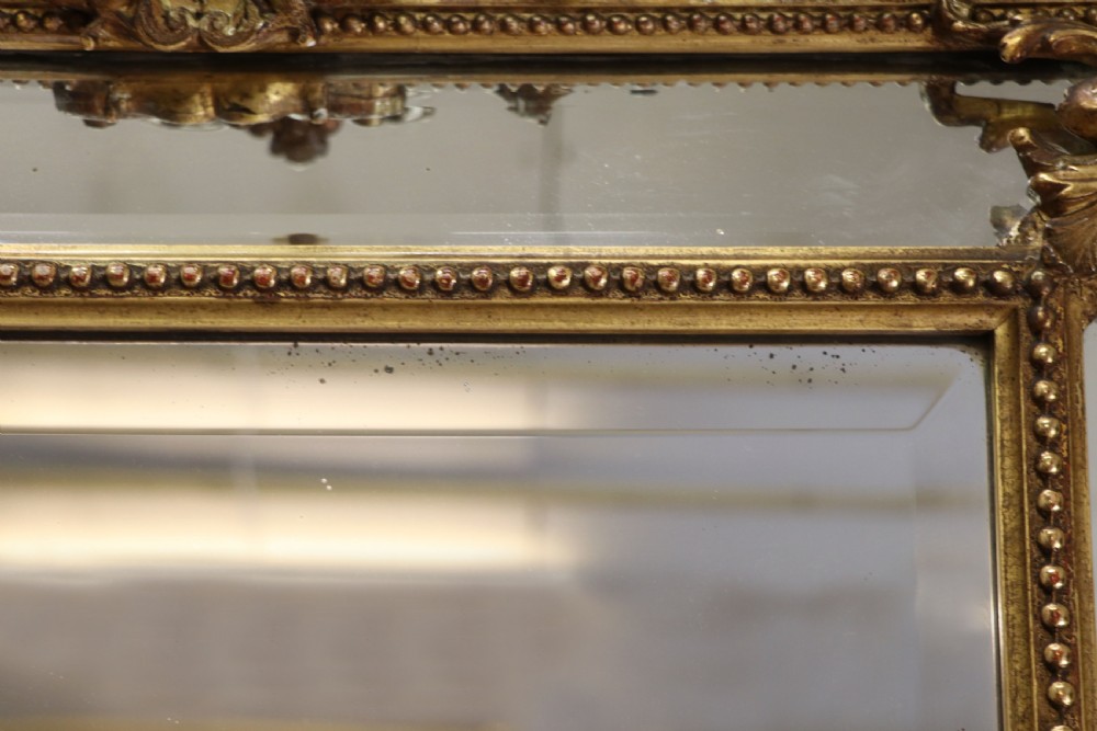 This lovely 19th century French mirror is of cushion form. View XVI