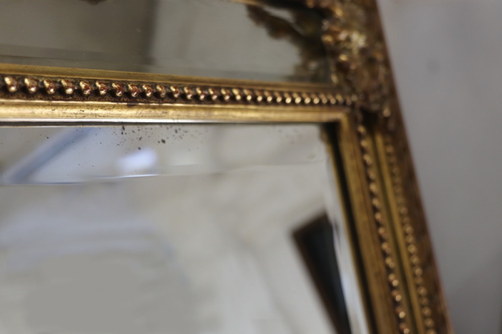 This lovely 19th century French mirror is of cushion form. View XVII