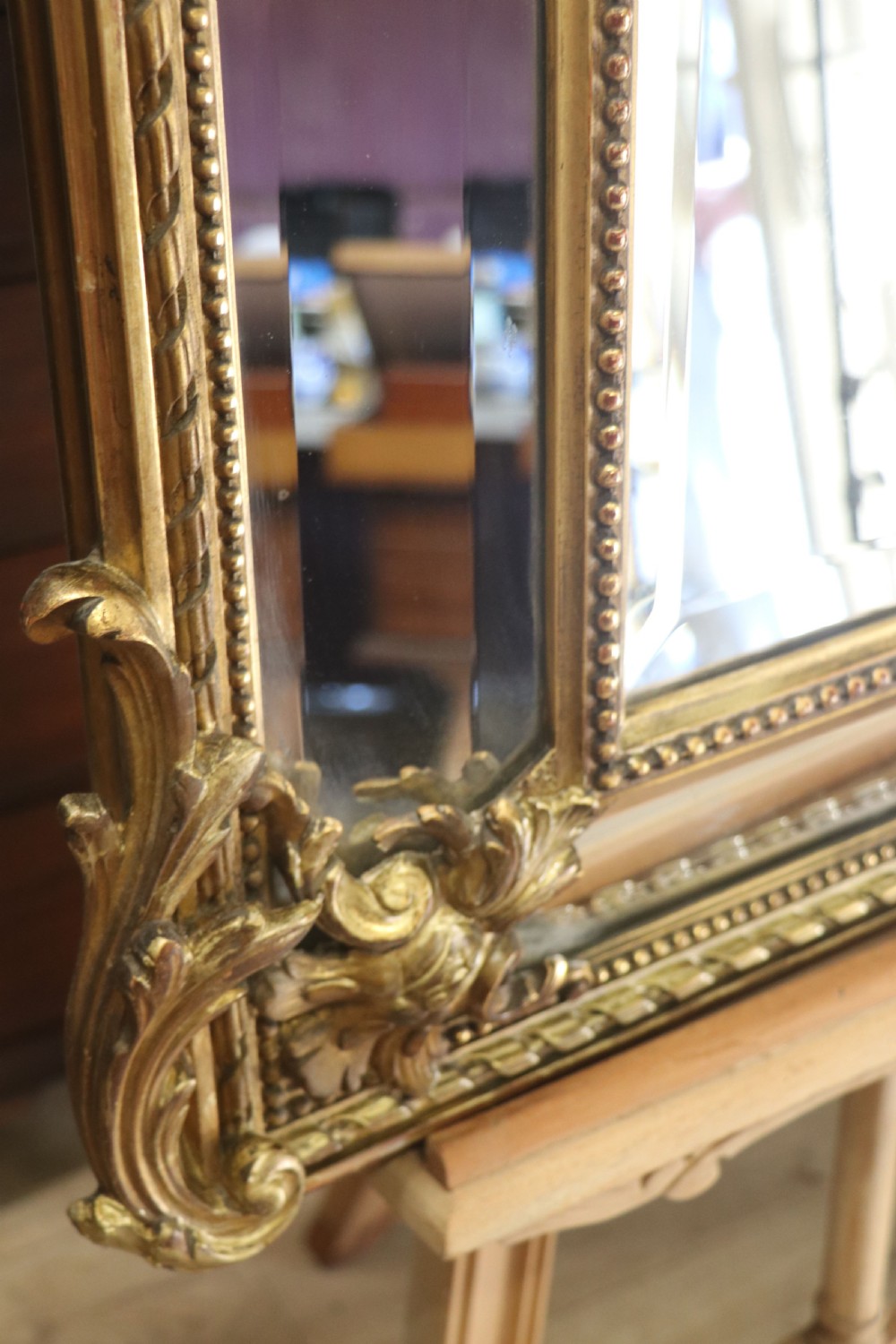 This lovely 19th century French mirror is of cushion form. View XVIII