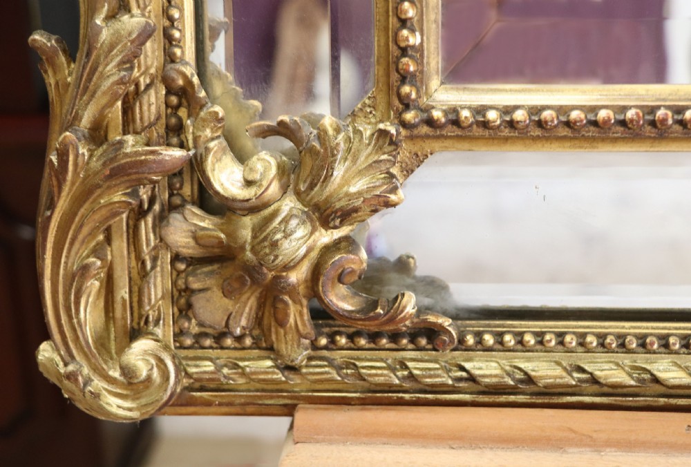 This lovely 19th century French mirror is of cushion form. View XIX