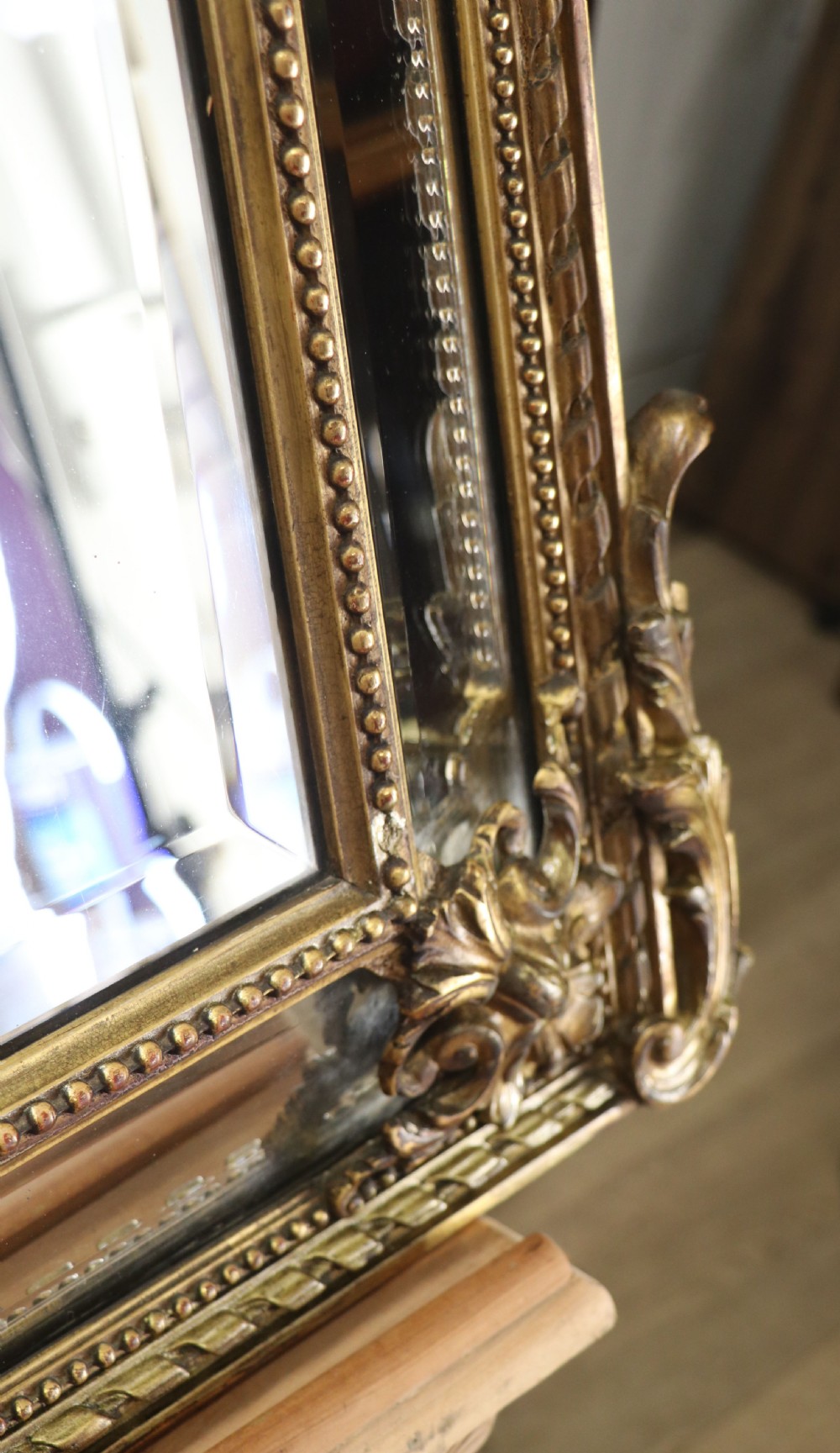 This lovely 19th century French mirror is of cushion form. View XX
