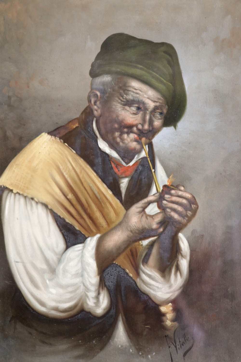 A pair of framed Italian oil portraits depicting an elderly man smoking a pipe and an elderly woman wearing a blue headscarf, both set in matching giltwood frames. View V