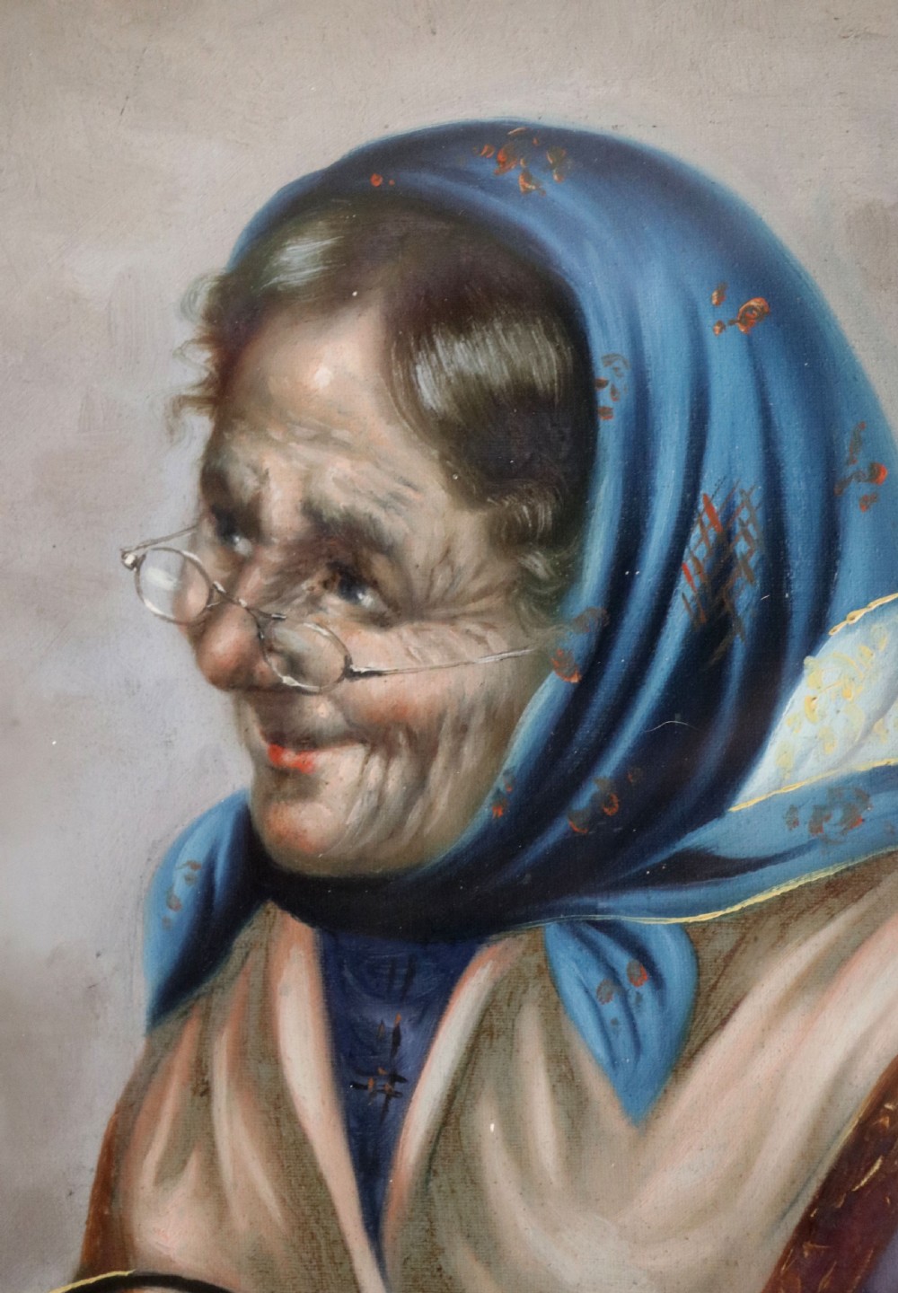 A pair of framed Italian oil portraits depicting an elderly man smoking a pipe and an elderly woman wearing a blue headscarf, both set in matching giltwood frames. View XI