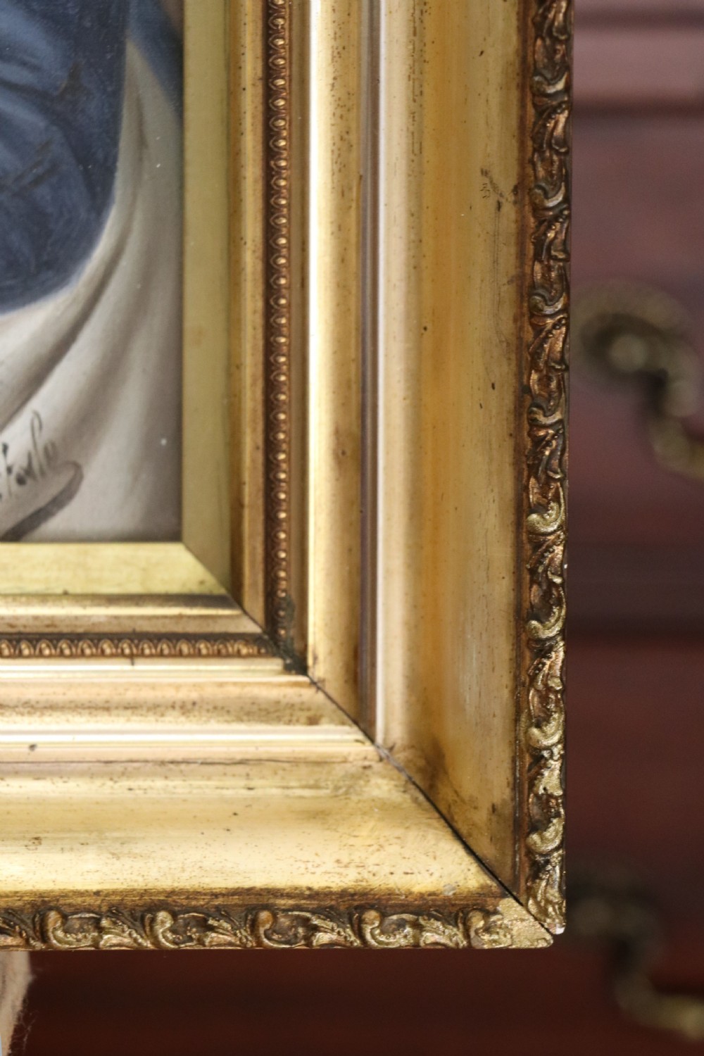 A pair of framed Italian oil portraits depicting an elderly man smoking a pipe and an elderly woman wearing a blue headscarf, both set in matching giltwood frames. View XIV