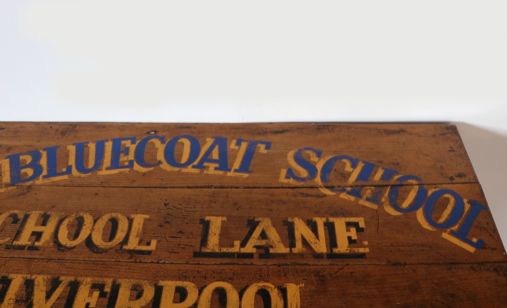 A Victorian black painted pine chest of drawers featuring a natural timber top with hand-painted lettering and turned wooden knobs. View IX