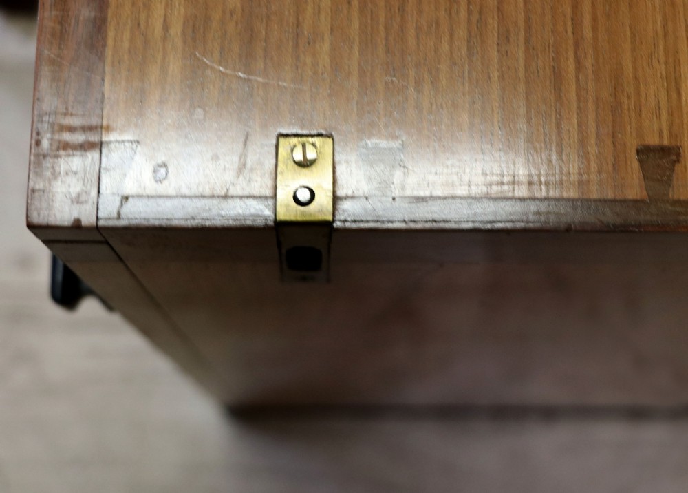 An Art Deco walnut pedestal desk featuring a glass-topped centre writing surface and hinged fold-out side flaps supported by twin cabinet bases. View XXVIII