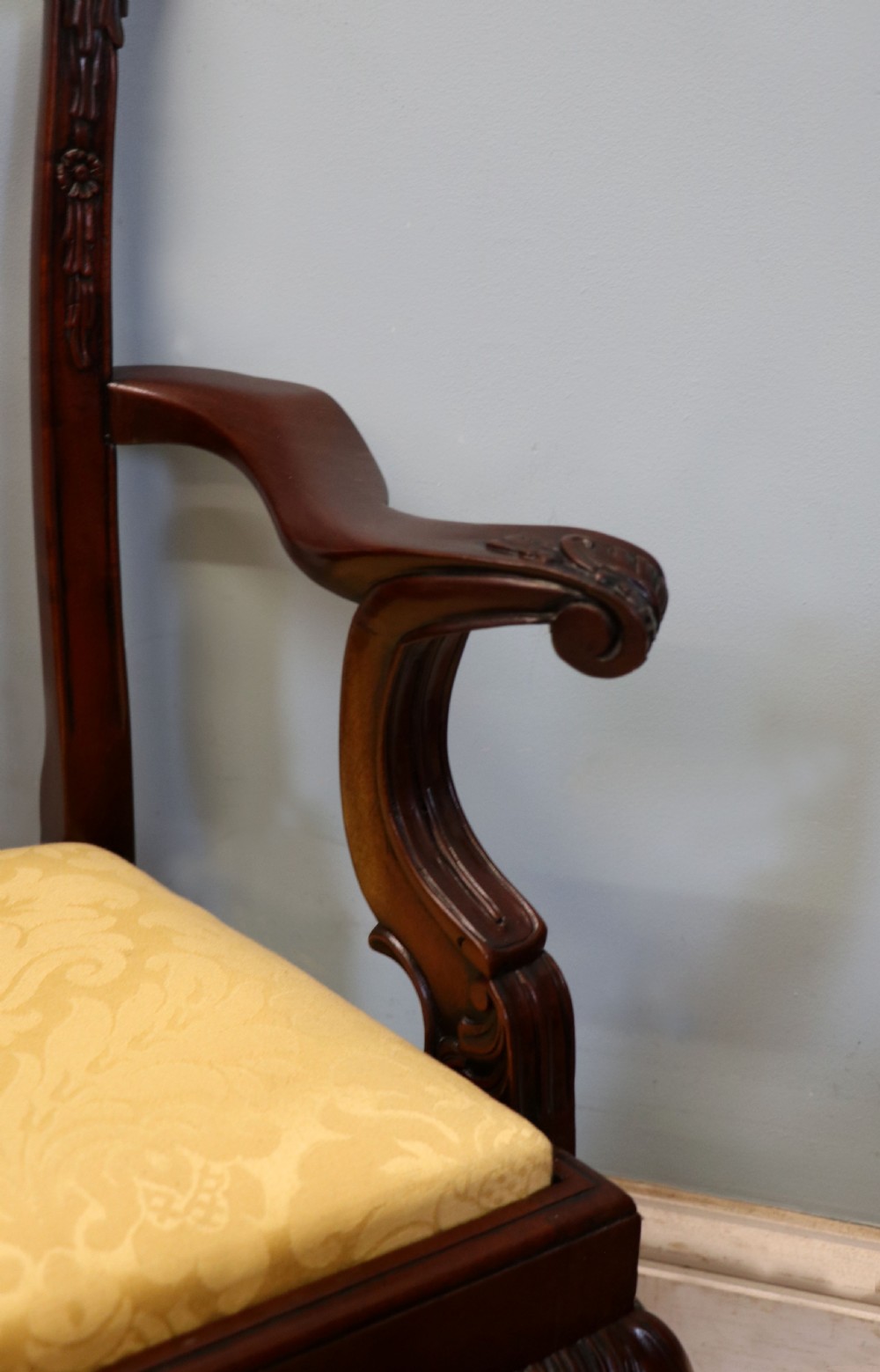 A pair of Georgian revival style child carver chairs made of polished dark mahogany with pierced splat backs, cabriole legs, ball and claw feet, and yellow damask upholstered seats. View XVIII