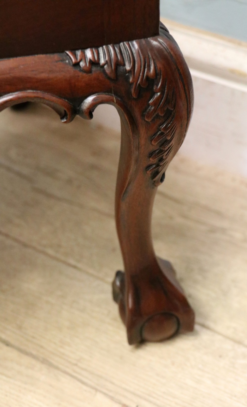 A pair of Georgian revival style child carver chairs made of polished dark mahogany with pierced splat backs, cabriole legs, ball and claw feet, and yellow damask upholstered seats. View XXIII