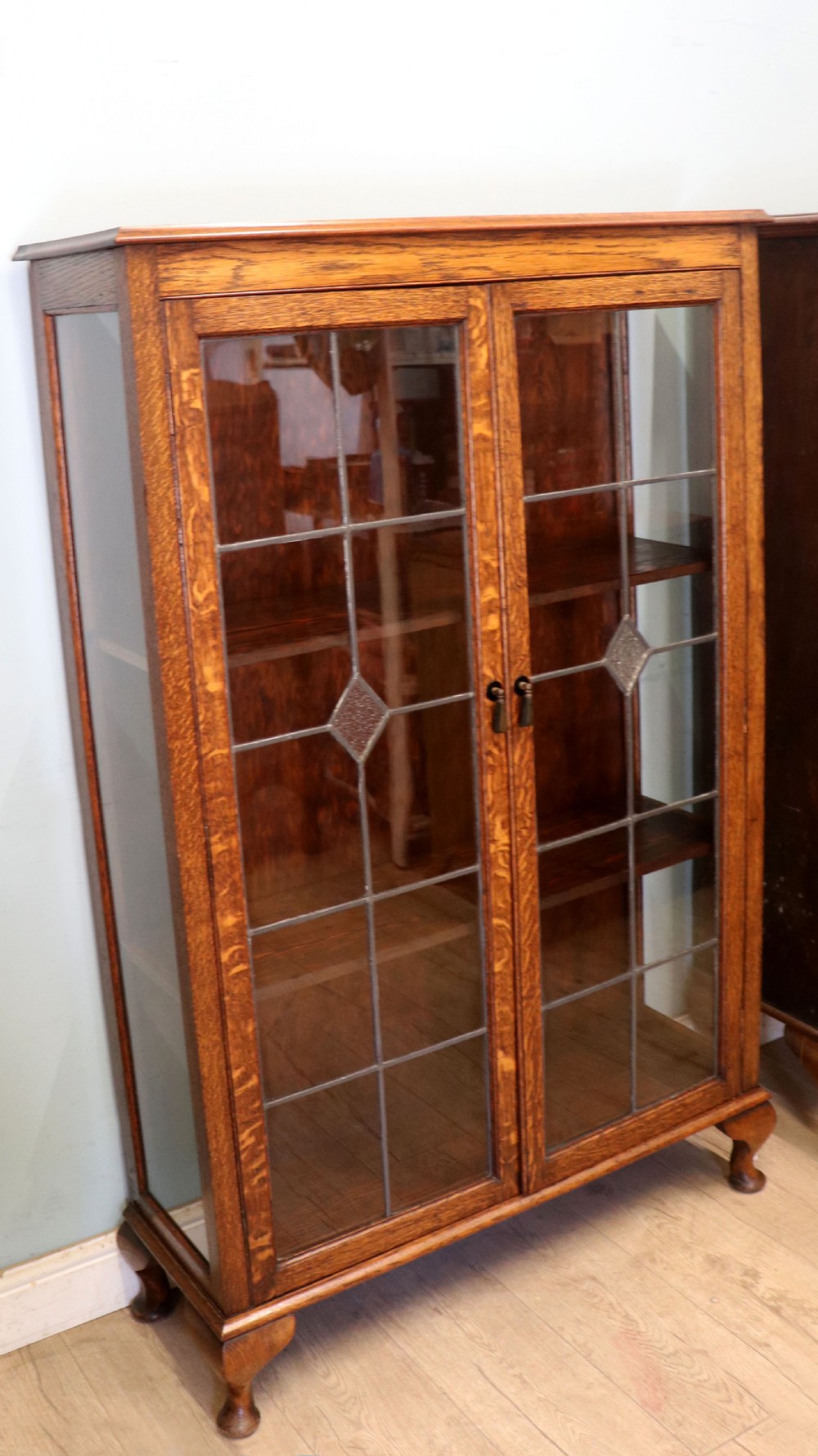 A lovely early 20th century oak framed and lead glazed display cabinet. View II