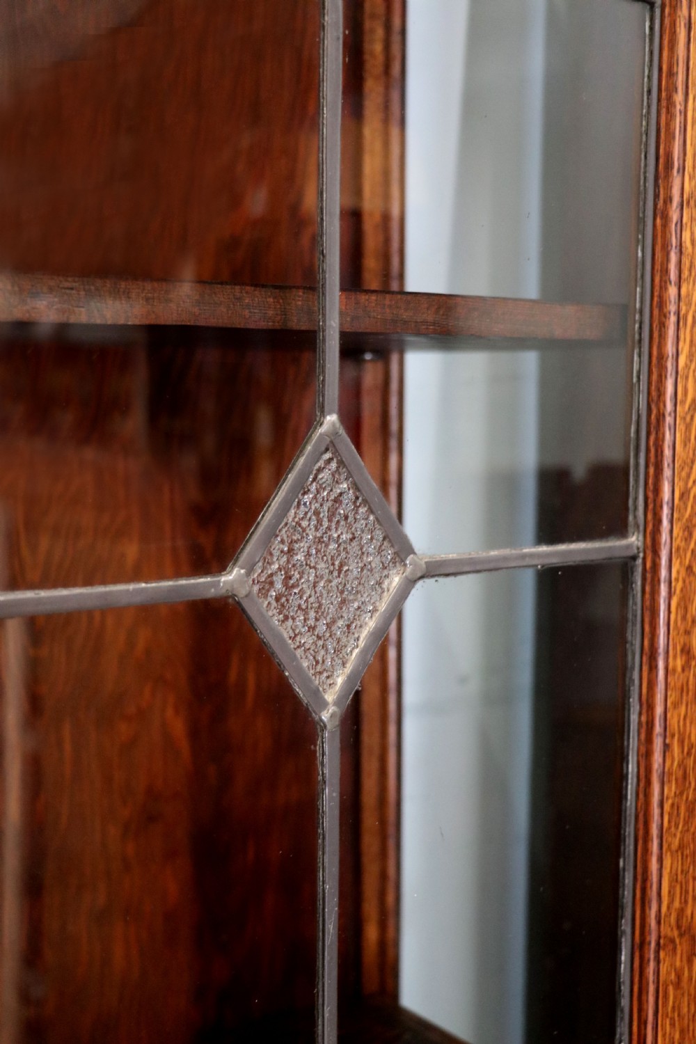A lovely early 20th century oak framed and lead glazed display cabinet. View XI