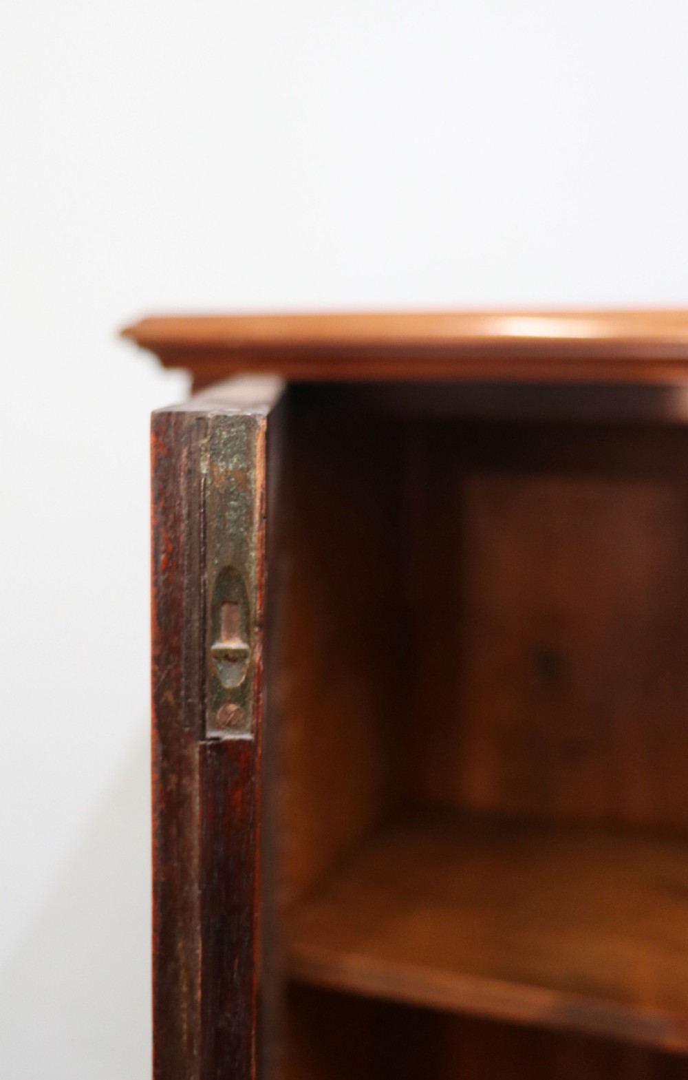 An early twentieth-century mahogany framed bookcase featuring two glazed doors decorated with the Home Office royal coat of arms stencil, supported on cabriole legs. View XIX