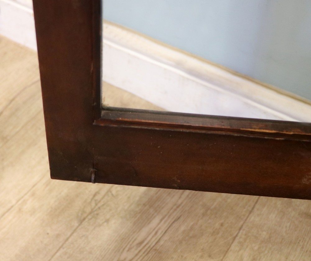 An early twentieth-century mahogany framed bookcase featuring two glazed doors decorated with the Home Office royal coat of arms stencil, supported on cabriole legs. View XXII