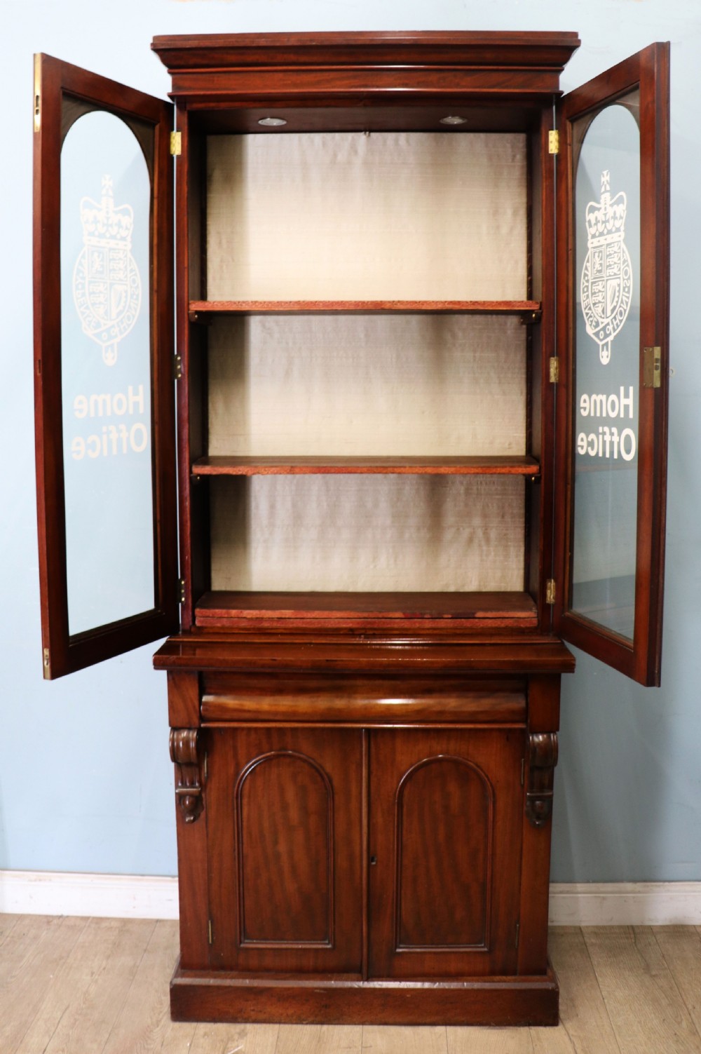 A beautiful quality Victorian mahogany bookcase cabinet, later sign written with the Home Office logo.  View II