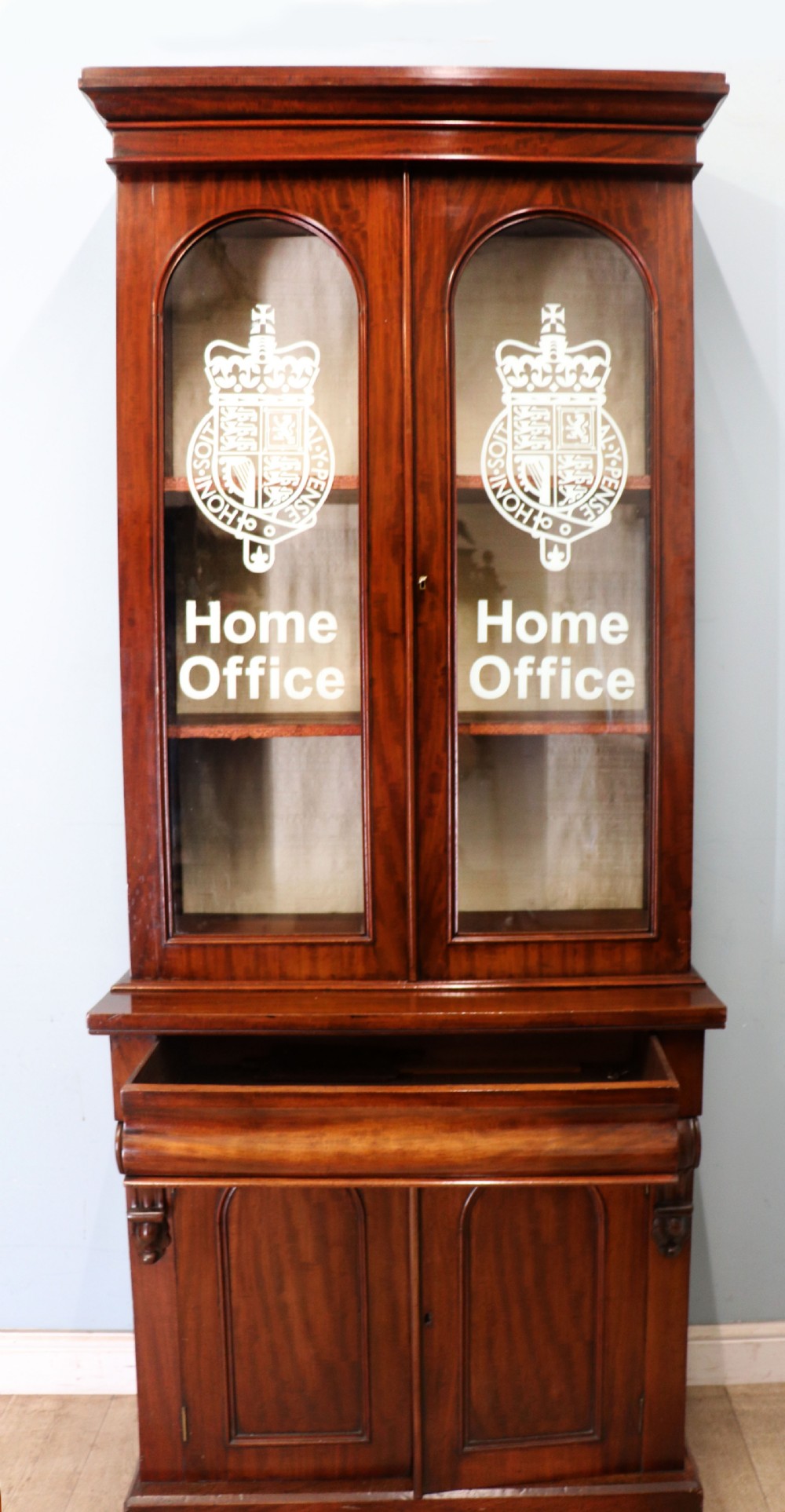 A beautiful quality Victorian mahogany bookcase cabinet, later sign written with the Home Office logo.  View III