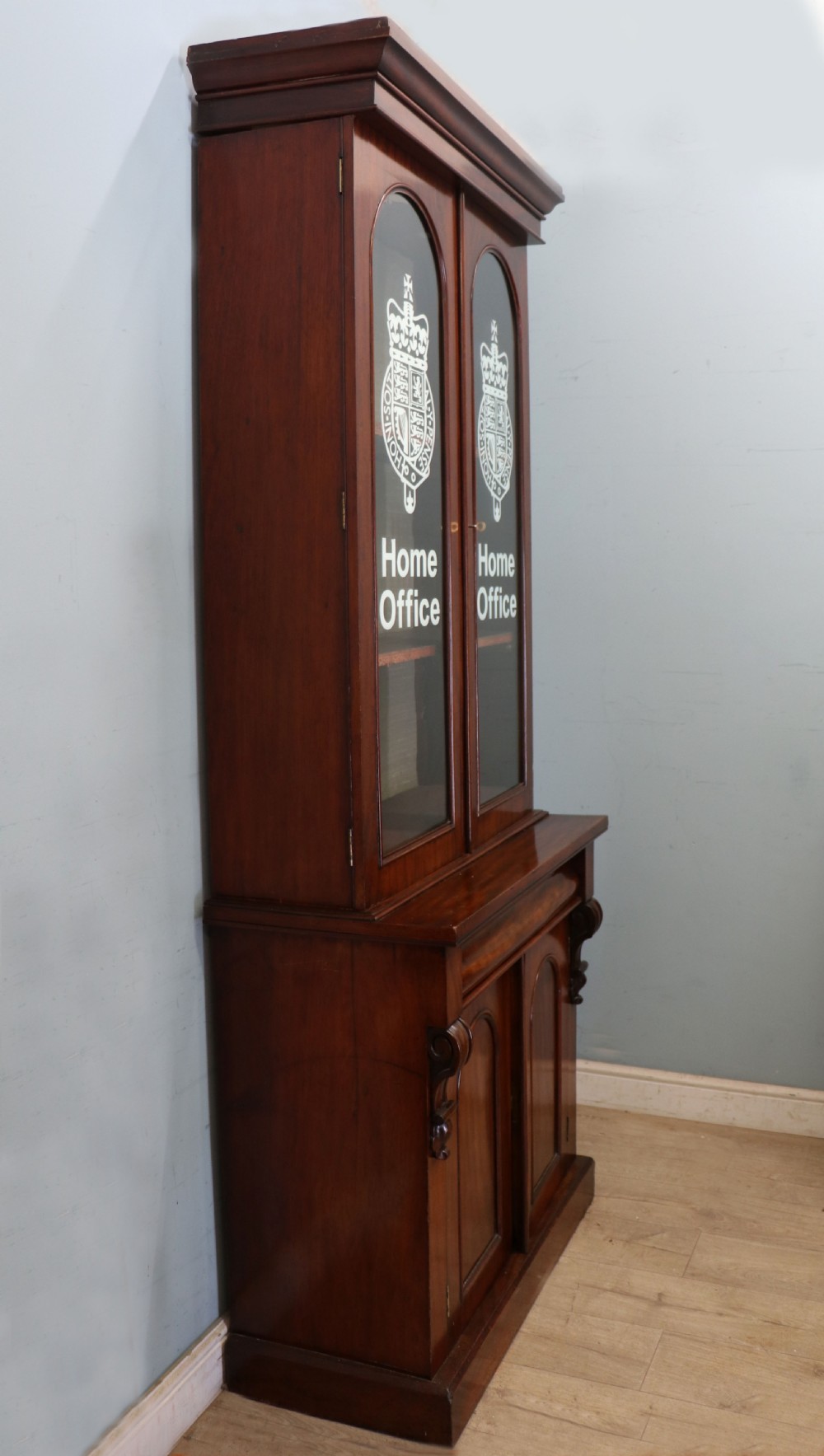 A beautiful quality Victorian mahogany bookcase cabinet, later sign written with the Home Office logo.  View V