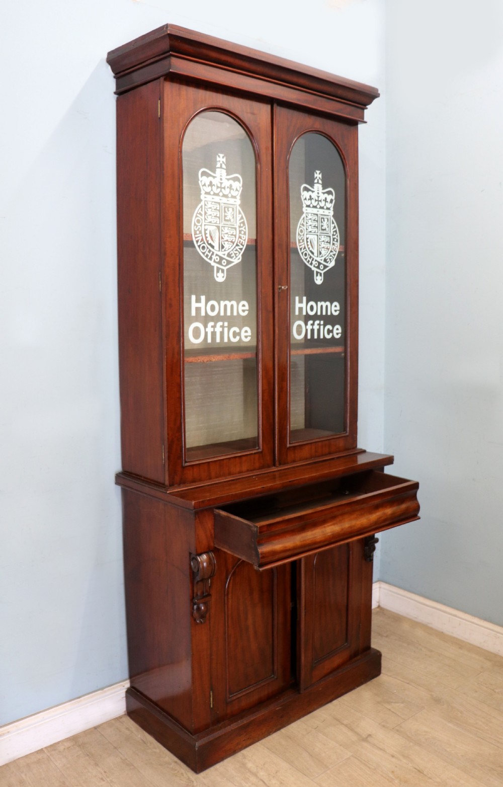 A beautiful quality Victorian mahogany bookcase cabinet, later sign written with the Home Office logo.  View VI