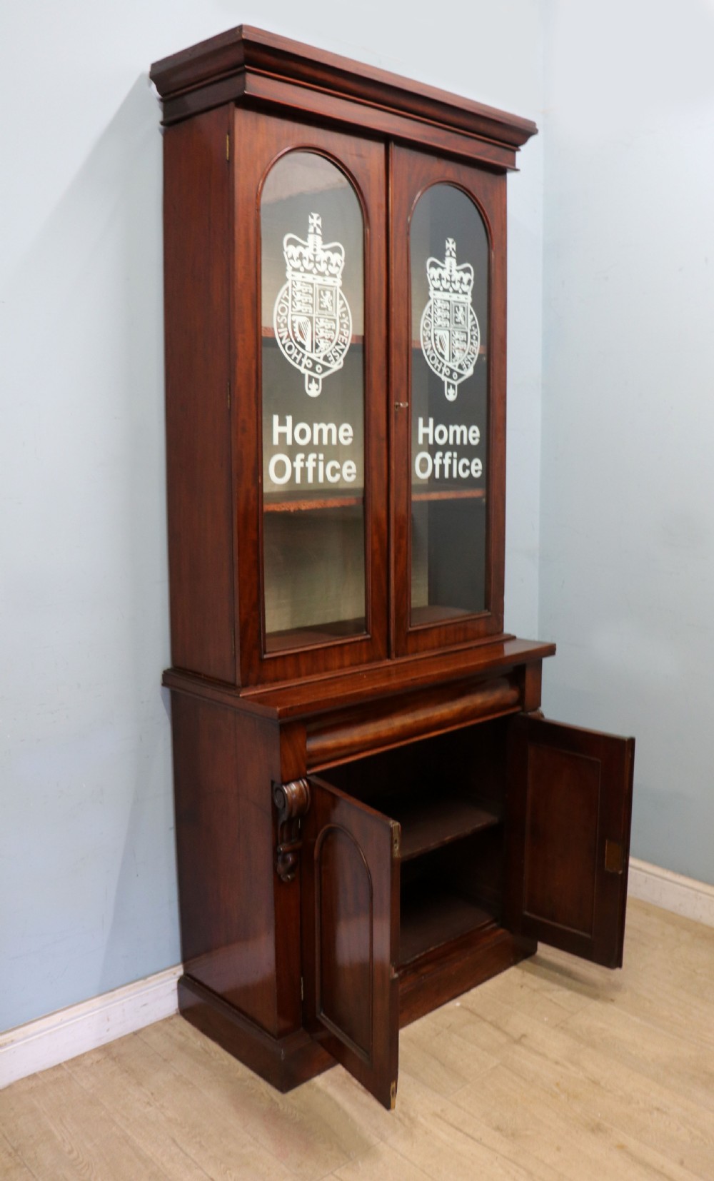 A beautiful quality Victorian mahogany bookcase cabinet, later sign written with the Home Office logo.  View VII