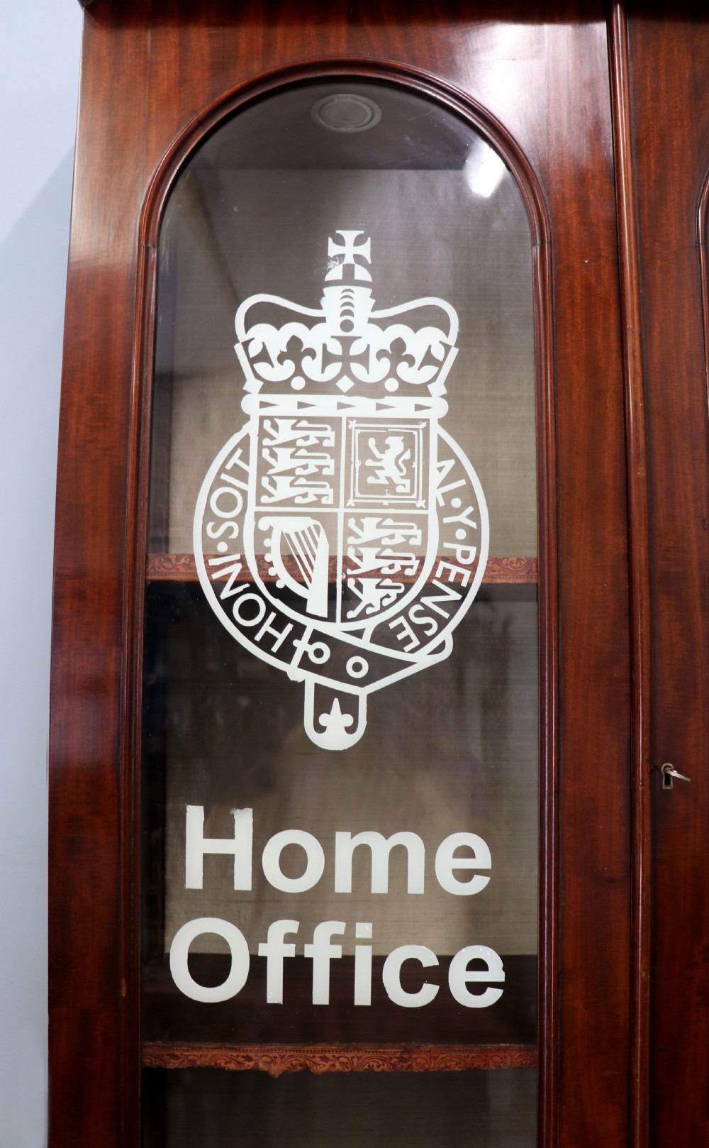 A beautiful quality Victorian mahogany bookcase cabinet, later sign written with the Home Office logo.  View VIII