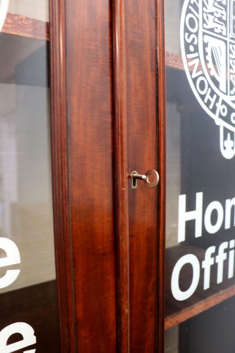 A beautiful quality Victorian mahogany bookcase cabinet, later sign written with the Home Office logo.  View XI