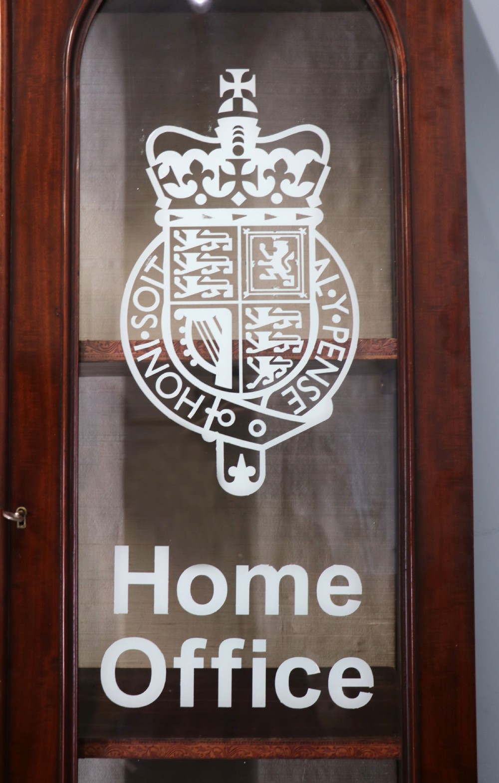 A beautiful quality Victorian mahogany bookcase cabinet, later sign written with the Home Office logo.  View XII