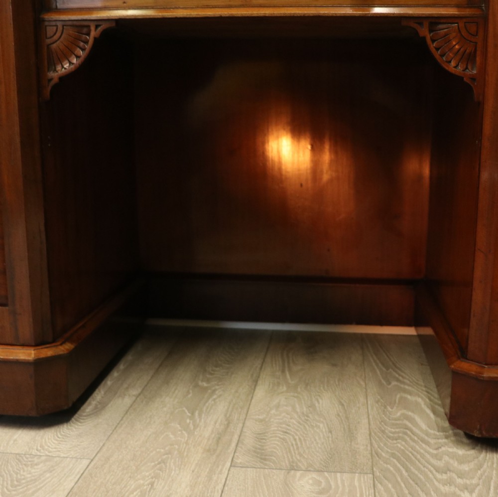 A Victorian Aesthetic Movement mahogany washstand featuring a white marble top, a tiled gallery splashback with floral motifs, two pedestal cupboards, and a central drawer. View XXII