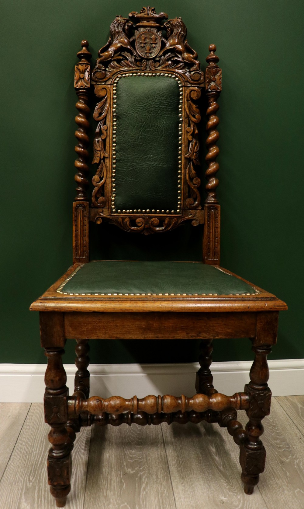 A lovely Victorian oak framed beautifully carved hall chair in the Carolean gothic revival style.