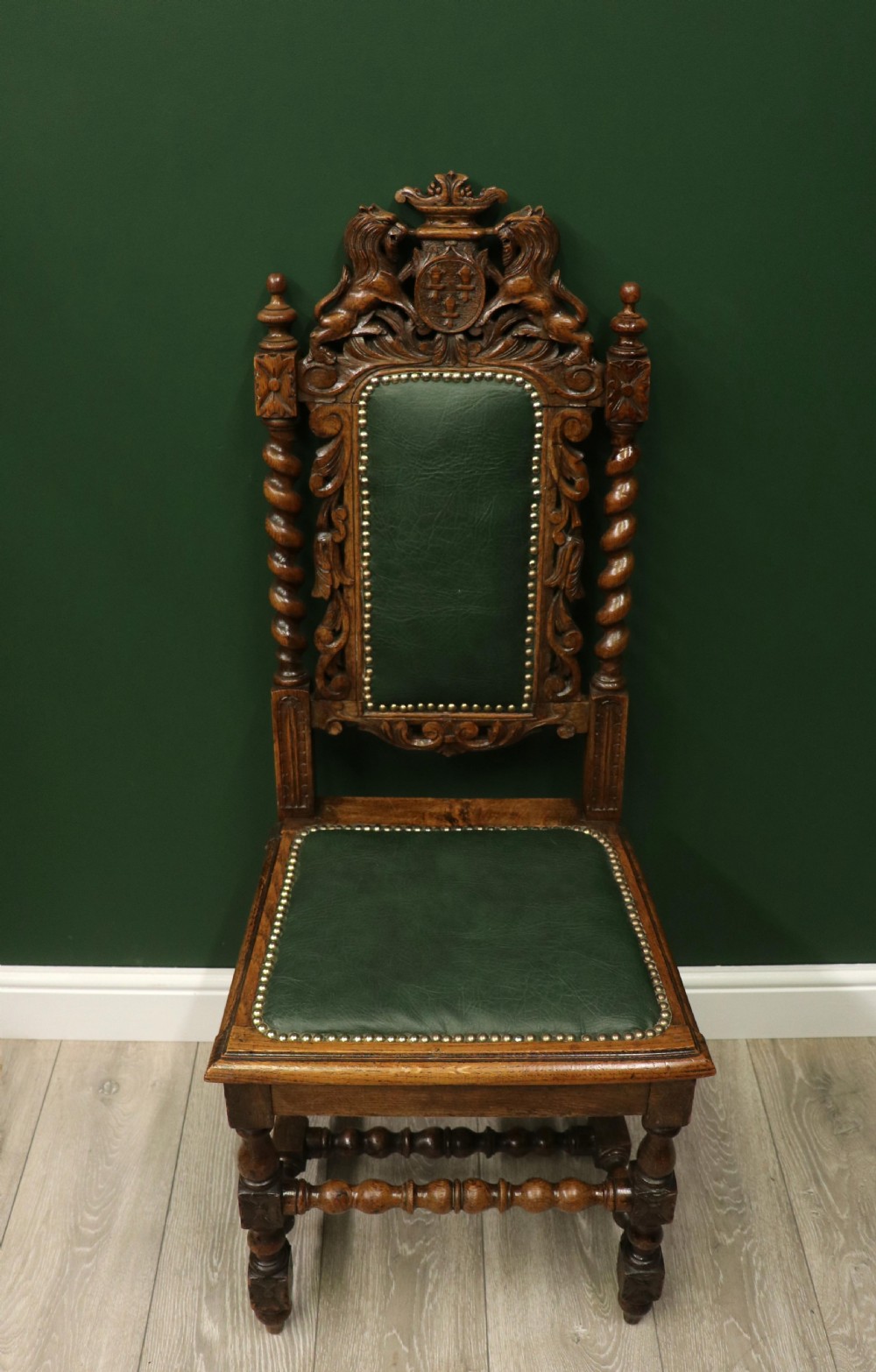 A lovely Victorian oak framed beautifully carved hall chair in the Carolean gothic revival style. View II
