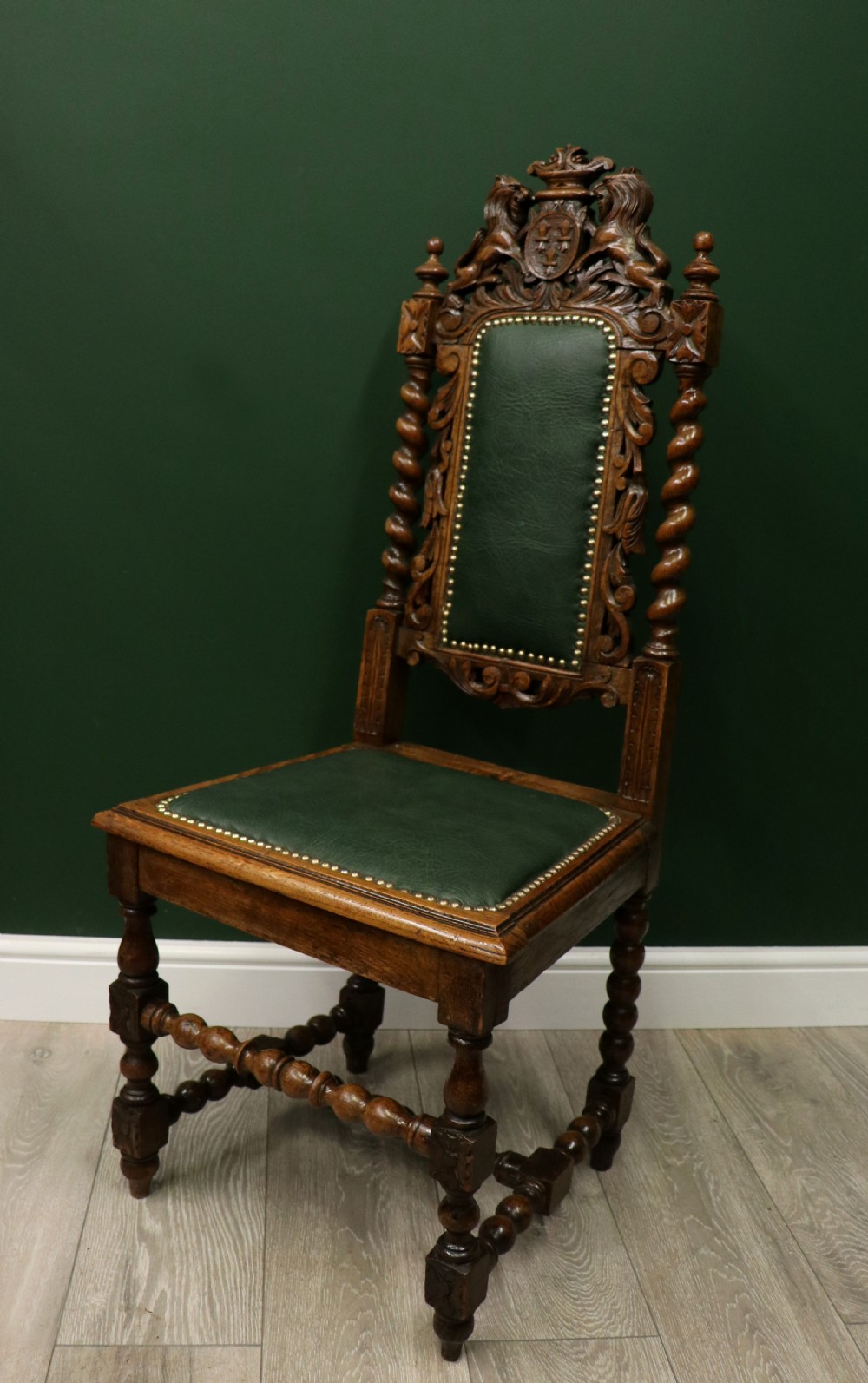 A lovely Victorian oak framed beautifully carved hall chair in the Carolean gothic revival style. View III