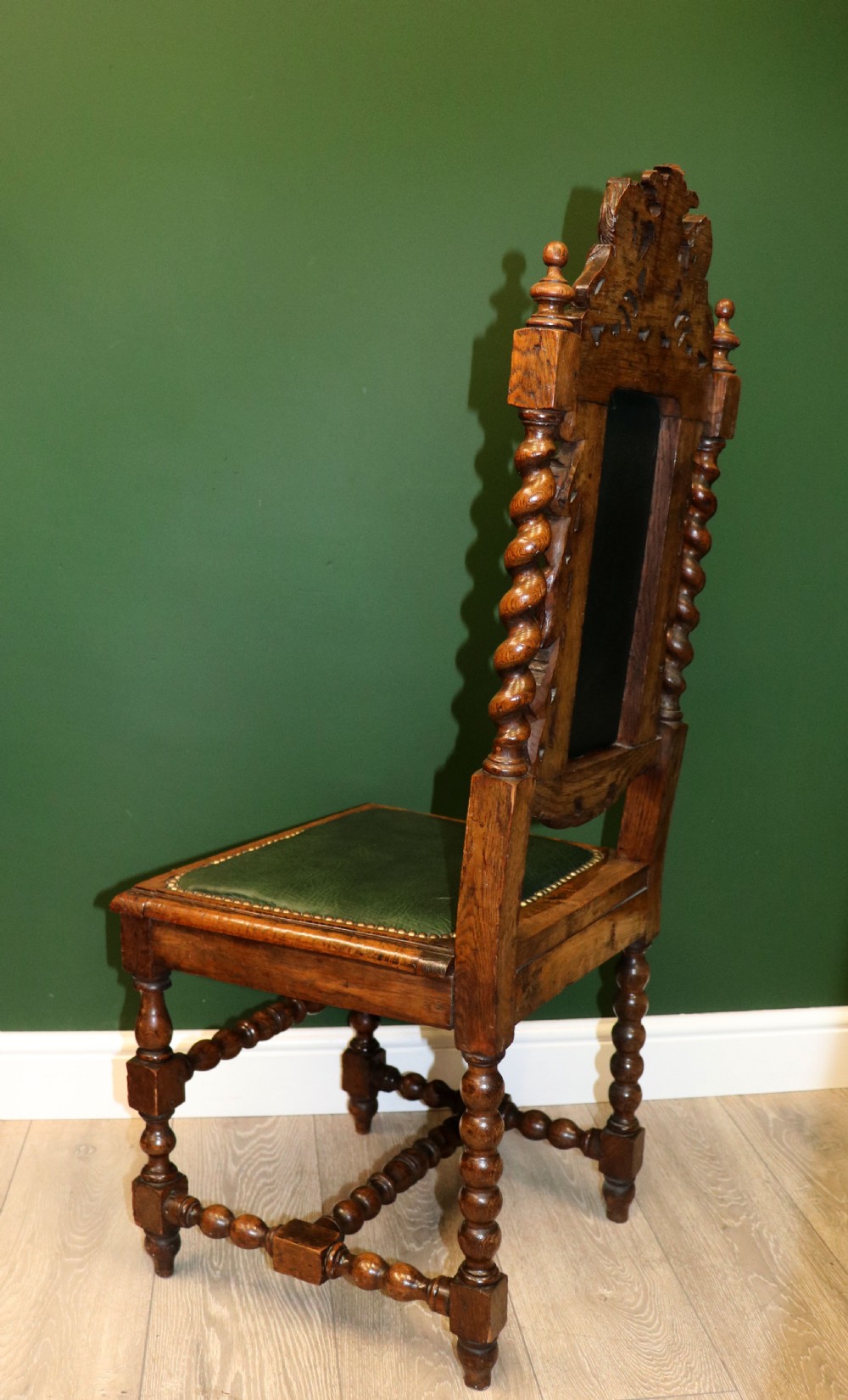 A lovely Victorian oak framed beautifully carved hall chair in the Carolean gothic revival style. View VI