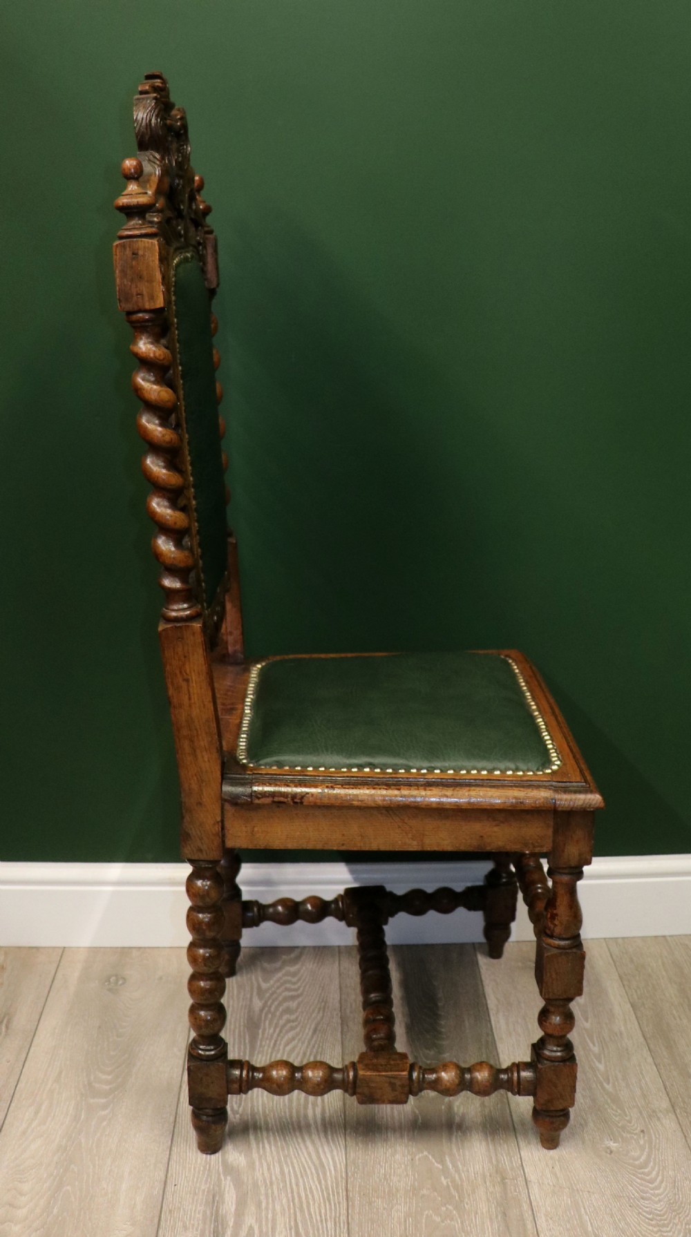 A lovely Victorian oak framed beautifully carved hall chair in the Carolean gothic revival style. View VII