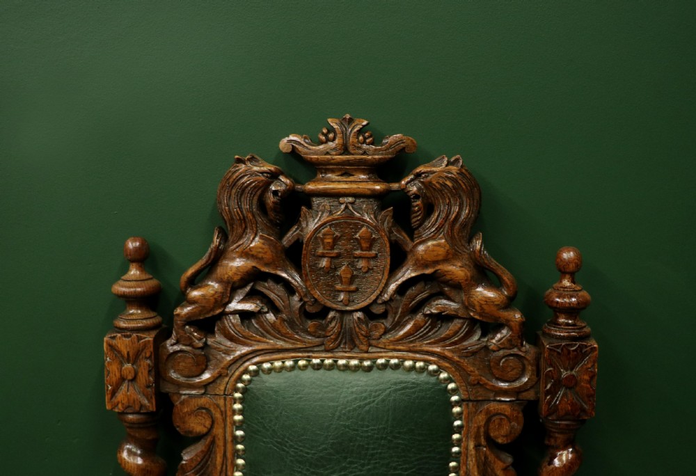 A lovely Victorian oak framed beautifully carved hall chair in the Carolean gothic revival style. View X