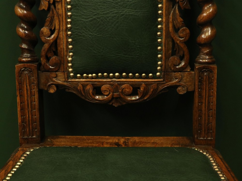 A lovely Victorian oak framed beautifully carved hall chair in the Carolean gothic revival style. View XI