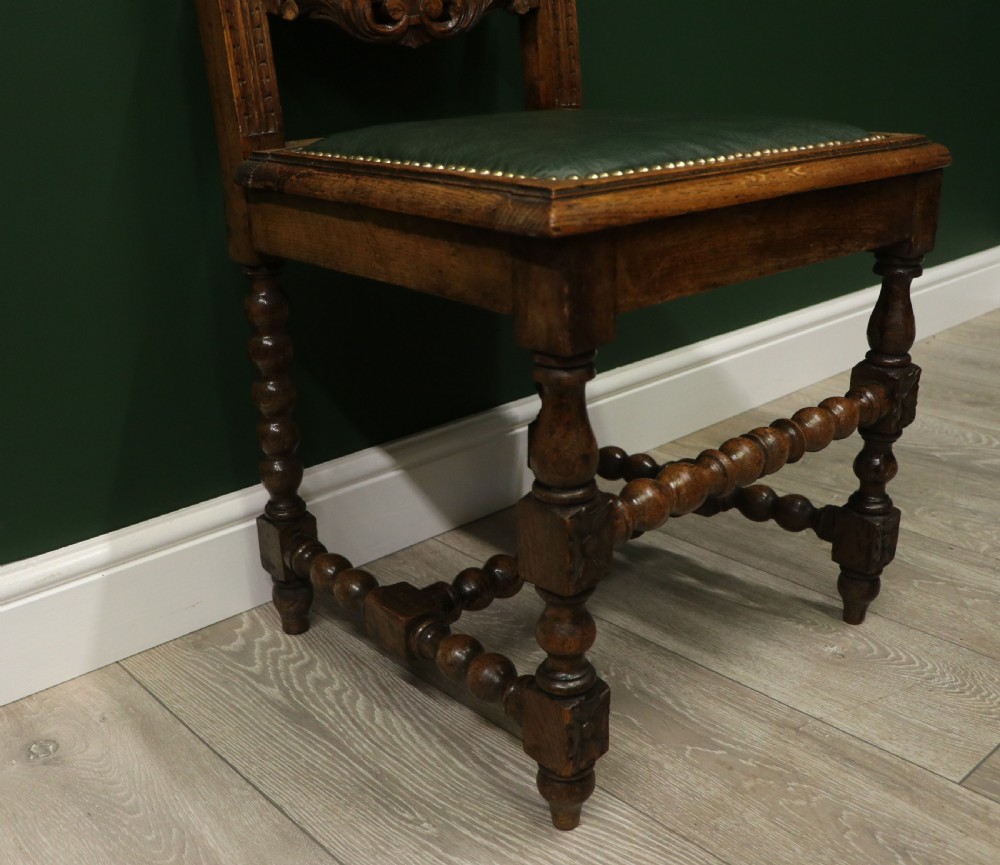 A lovely Victorian oak framed beautifully carved hall chair in the Carolean gothic revival style. View XIII
