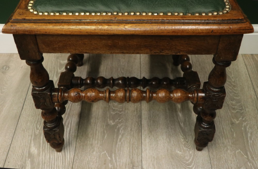 A lovely Victorian oak framed beautifully carved hall chair in the Carolean gothic revival style. View XIV