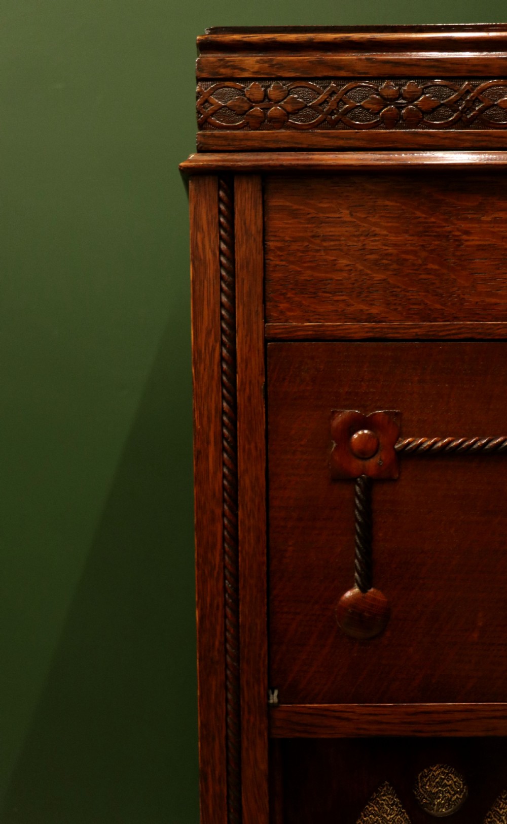 An upright dark oak parlour gramophone cabinet featuring cabriole legs, a hinged lid, carved rope detailing, and gothic arch fretwork grilles. View XXIV