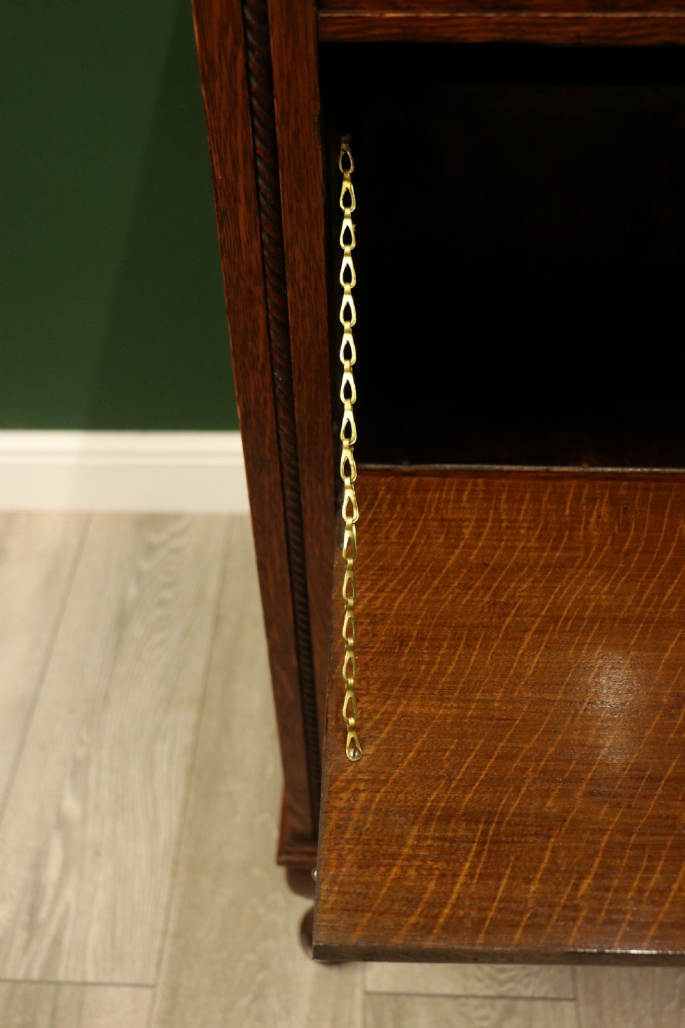 An upright dark oak parlour gramophone cabinet featuring cabriole legs, a hinged lid, carved rope detailing, and gothic arch fretwork grilles. View XXVI