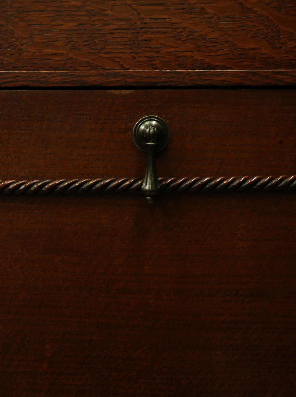 An upright dark oak parlour gramophone cabinet featuring cabriole legs, a hinged lid, carved rope detailing, and gothic arch fretwork grilles. View XXX