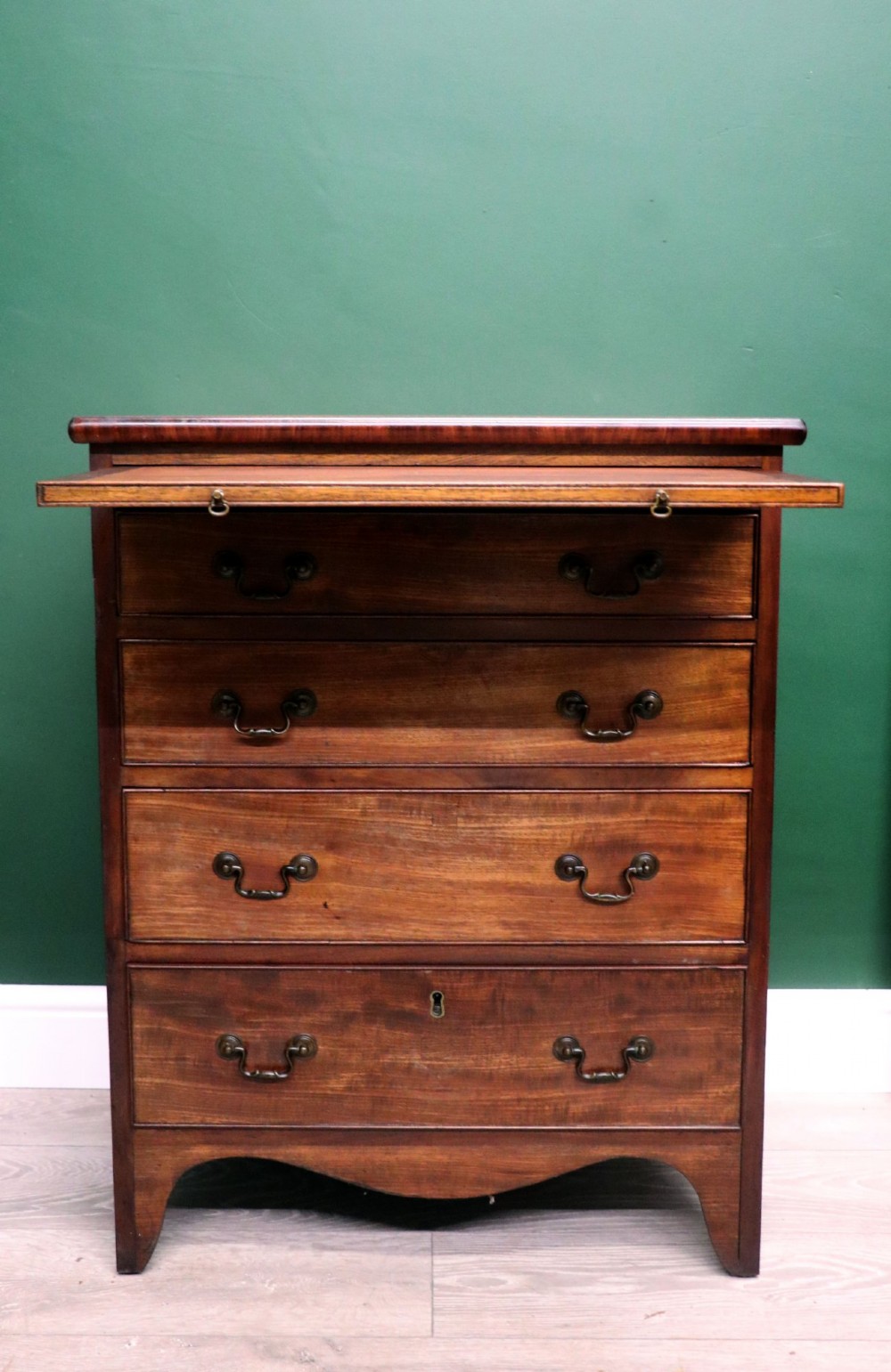 A lovely mahogany bachelors chest constructed in the George III style.