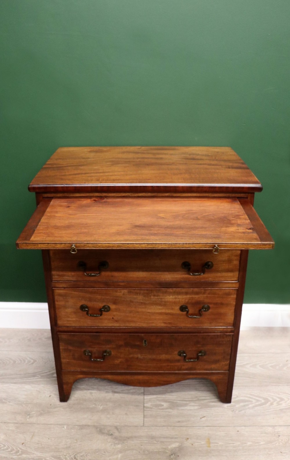 A lovely mahogany bachelors chest constructed in the George III style. View II