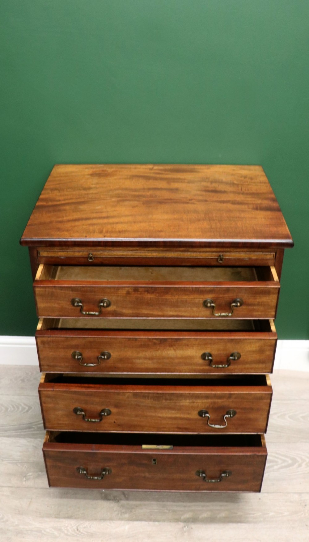 A lovely mahogany bachelors chest constructed in the George III style. View IV