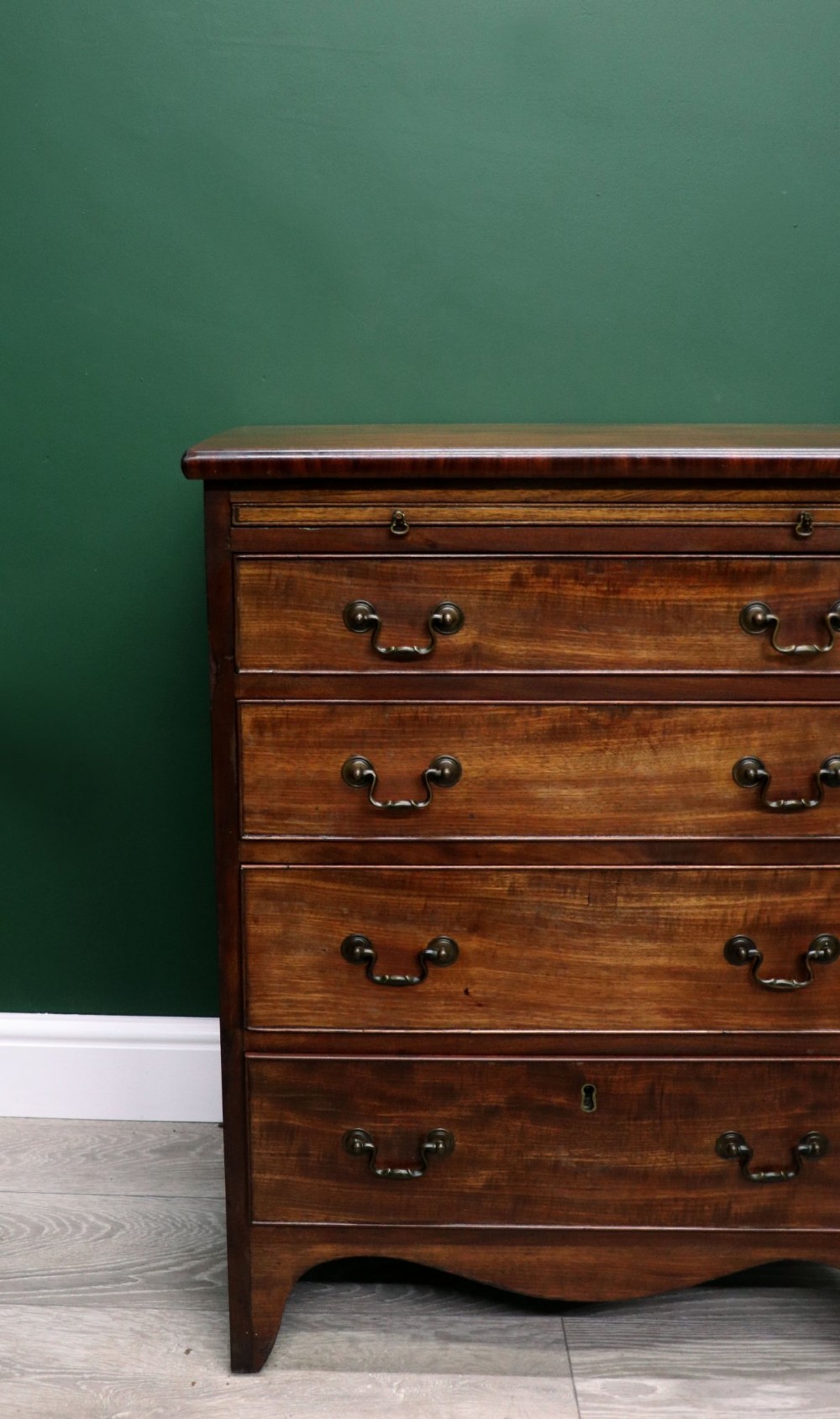 A lovely mahogany bachelors chest constructed in the George III style. View V