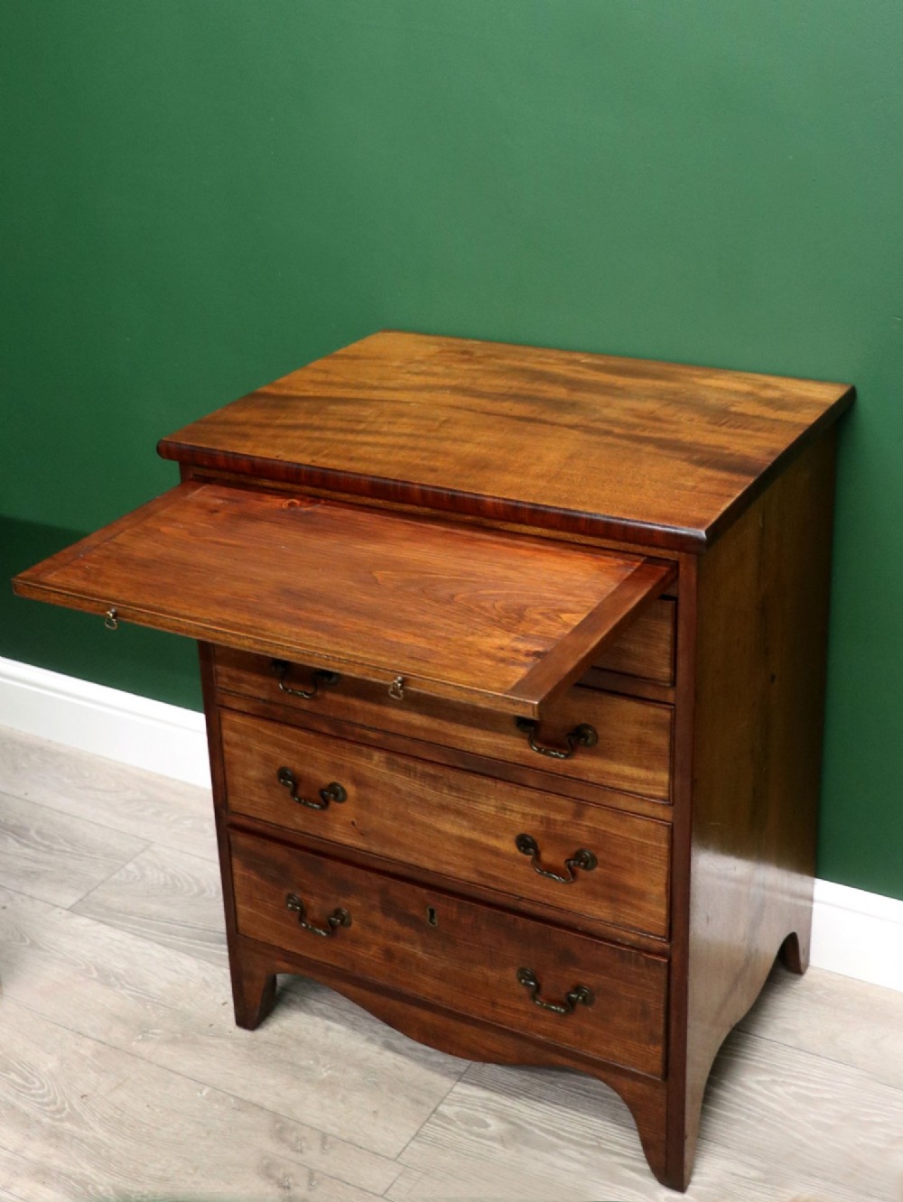 A lovely mahogany bachelors chest constructed in the George III style. View VI