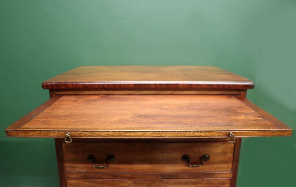A lovely mahogany bachelors chest constructed in the George III style. View VII