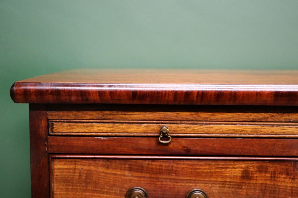 A lovely mahogany bachelors chest constructed in the George III style. View IX