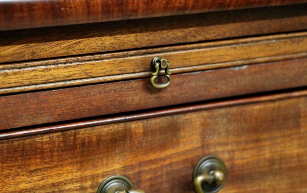 A lovely mahogany bachelors chest constructed in the George III style. View XII